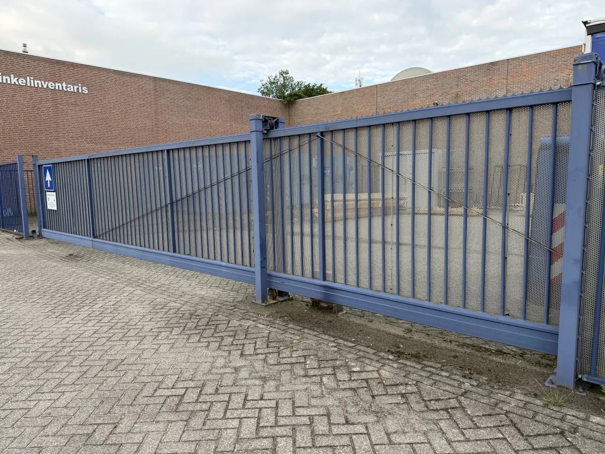 Heavy-Duty Blue Steel Sliding Gate with Anti-Climb Spikes – Approx. 8m Wide