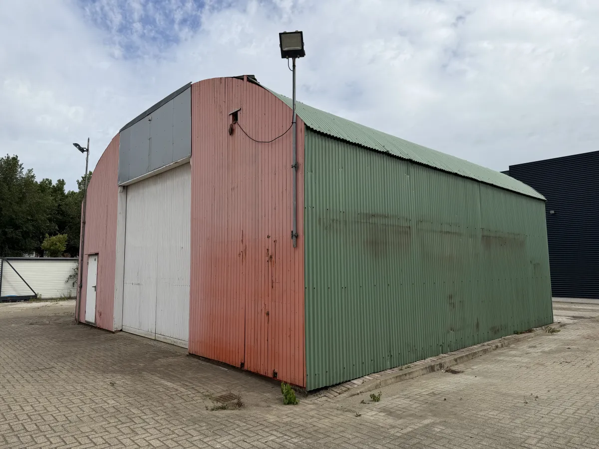 Used Steel Romney Structure with Timber Purlins & Corrugated Roof Sheets (110 m2)