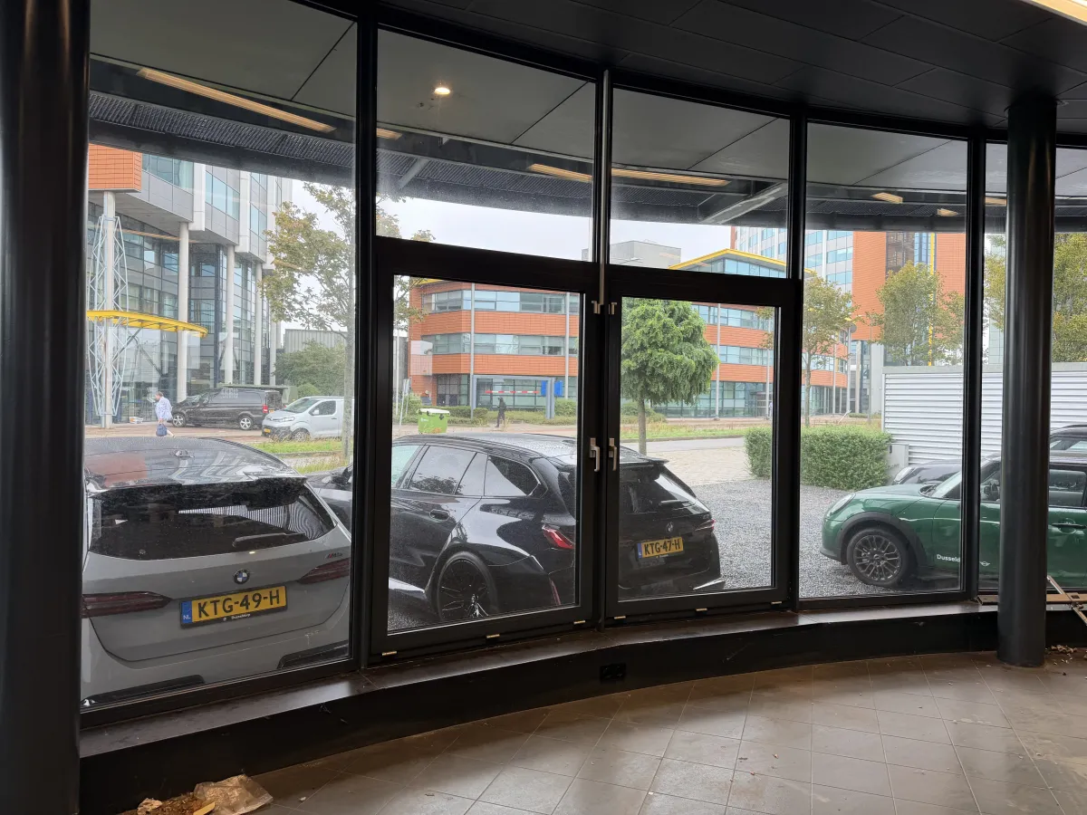 Steel Roof Structure with Corrugated Deck, LED Strip Lights & Glazed Curtain Wall Canopy